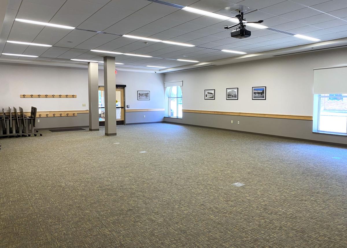 Large empty room with grey and white walls. 